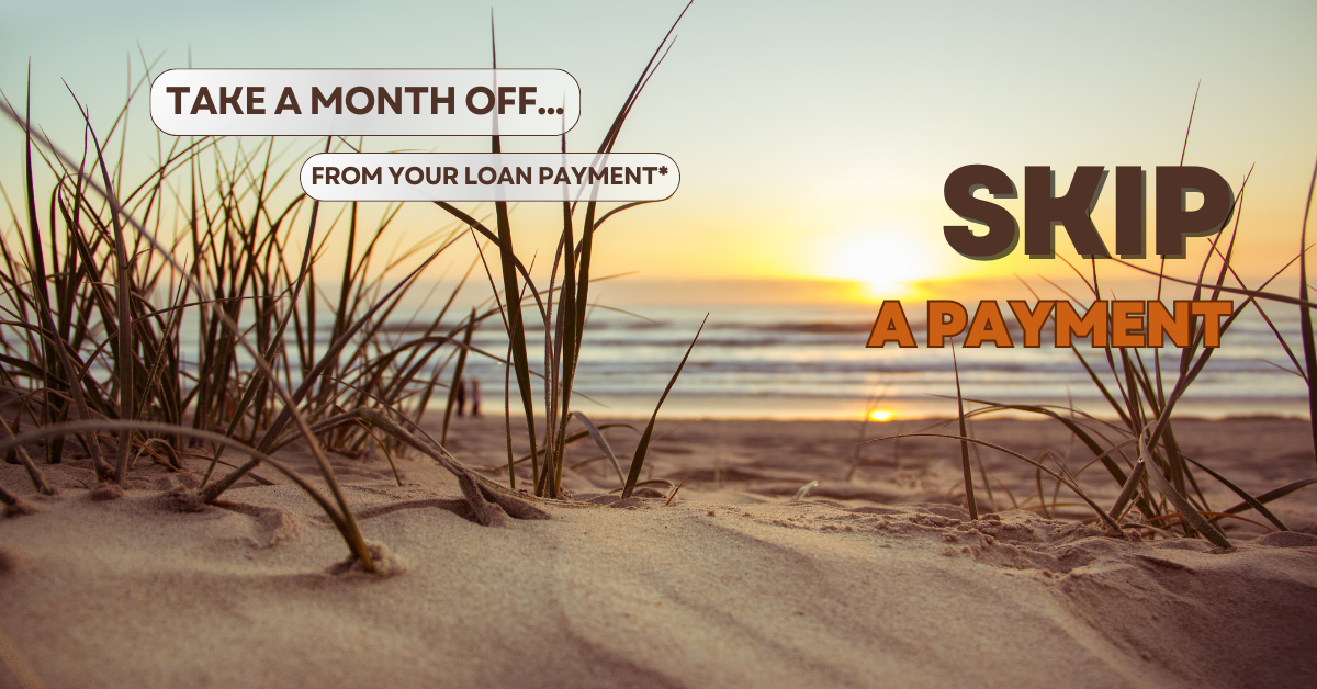 Scene showing sand dunes on a beach. Text says "Take a month off...from your loan payment". Also says "Skip A Payment".