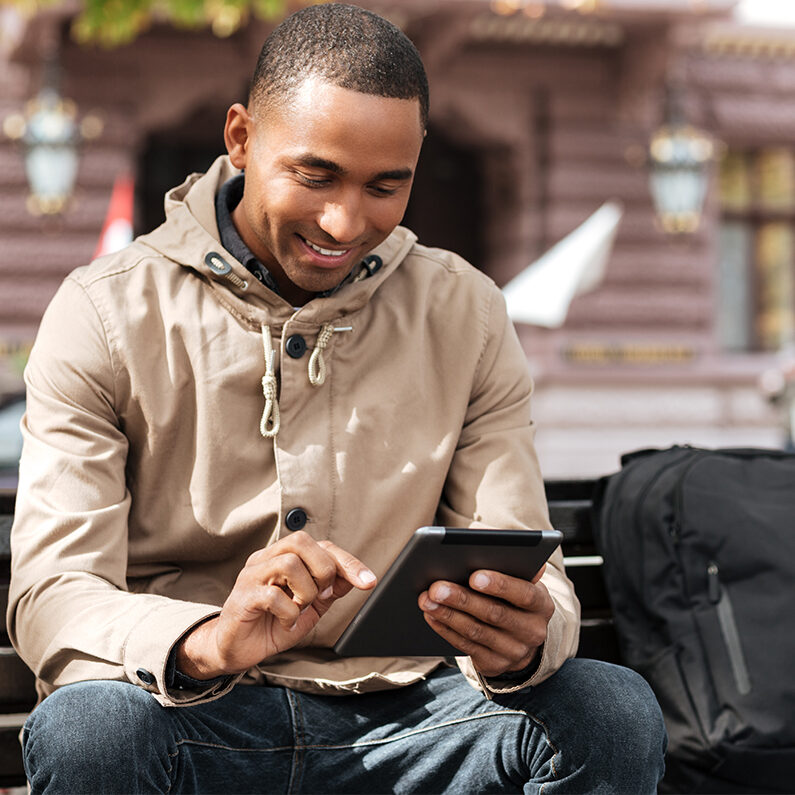 happy man using mobile banking